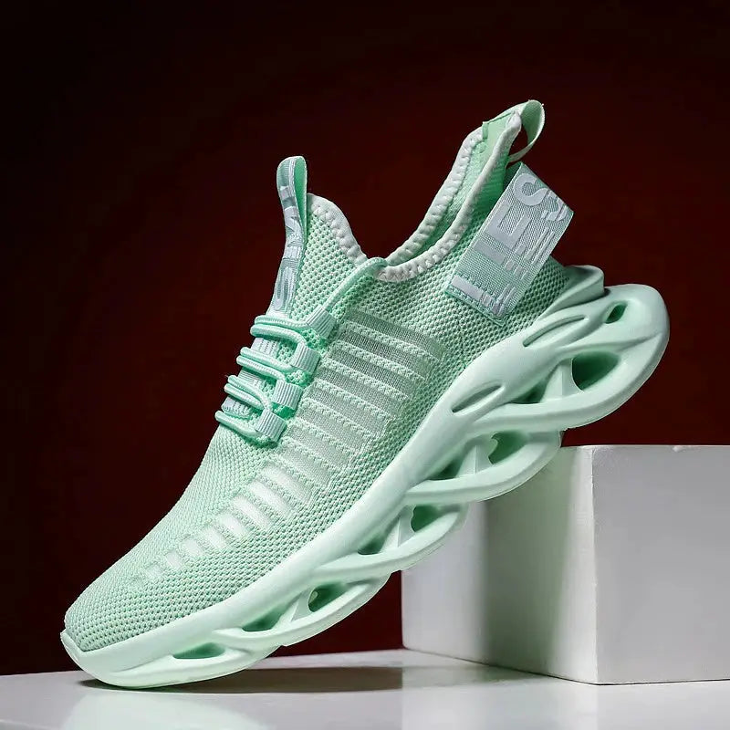 Unisex running sneakers in mint green with breathable knit upper and sculpted white sole