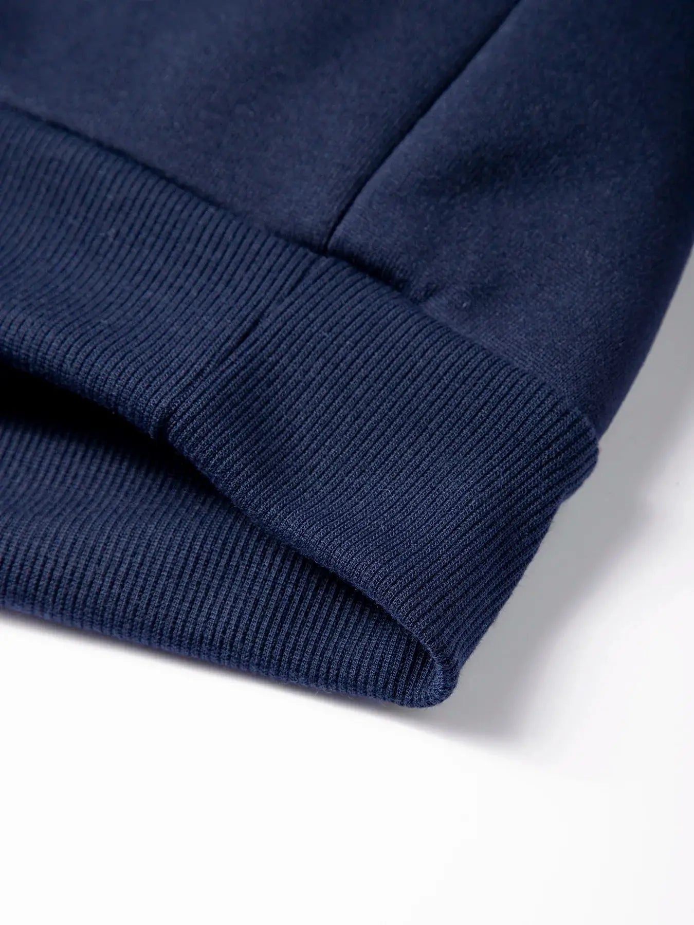 Men's navy pullover sweater sleeve with ribbed cuff detail
