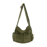Simples Market olive green canvas women's messenger bag with adjustable shoulder strap.