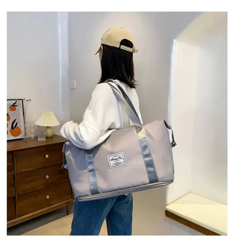 UNIXINU carry-on duffle bag in light gray nylon with wide gray straps, Simples Market brand