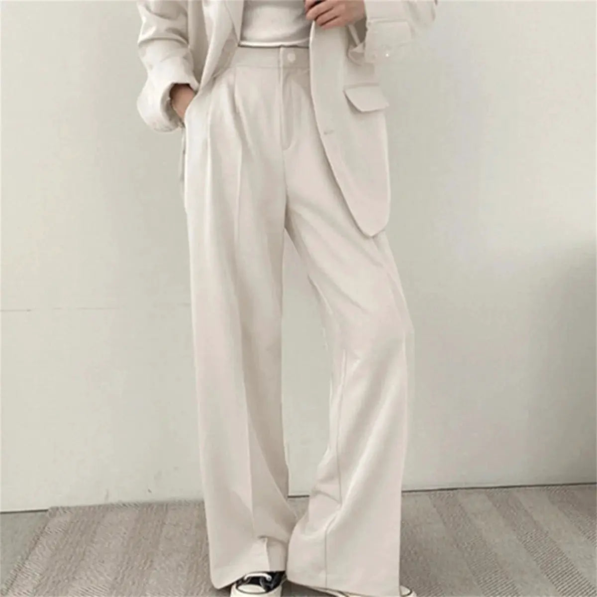 Cream two-piece women's blazer and wide-leg pants suit set; office/business look