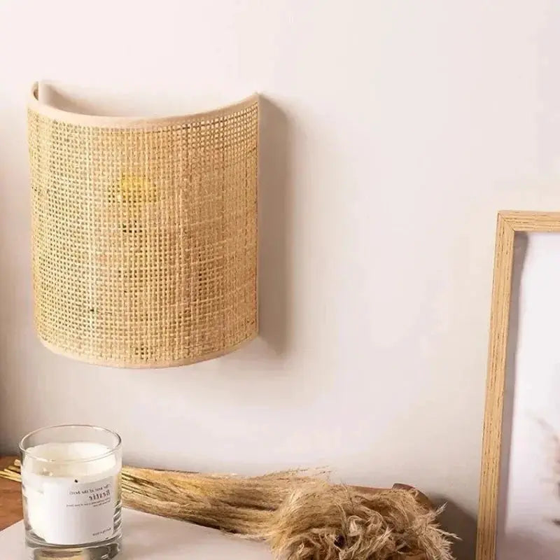 Rattan wall lamp by Simples Market; natural beige woven sconce with LED lighting for living room or bedroom