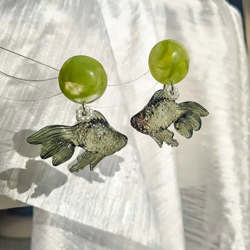 Pair of goldfish pendant earrings with translucent lime-green beads and pearl spacers