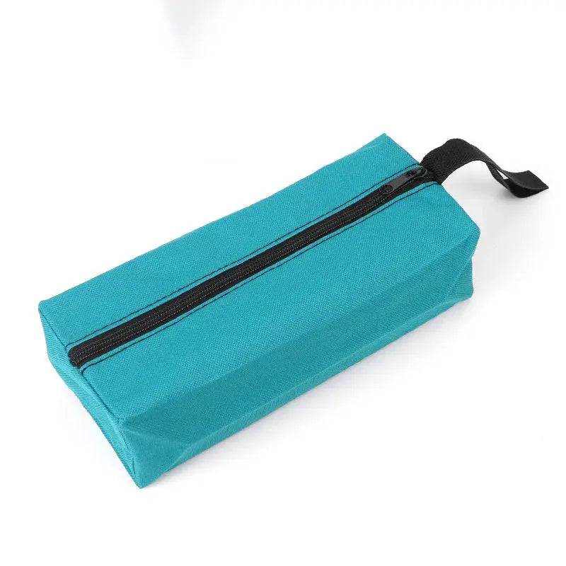 Small Oxford cloth hand-held tool bag in teal with black zipper and carry loop