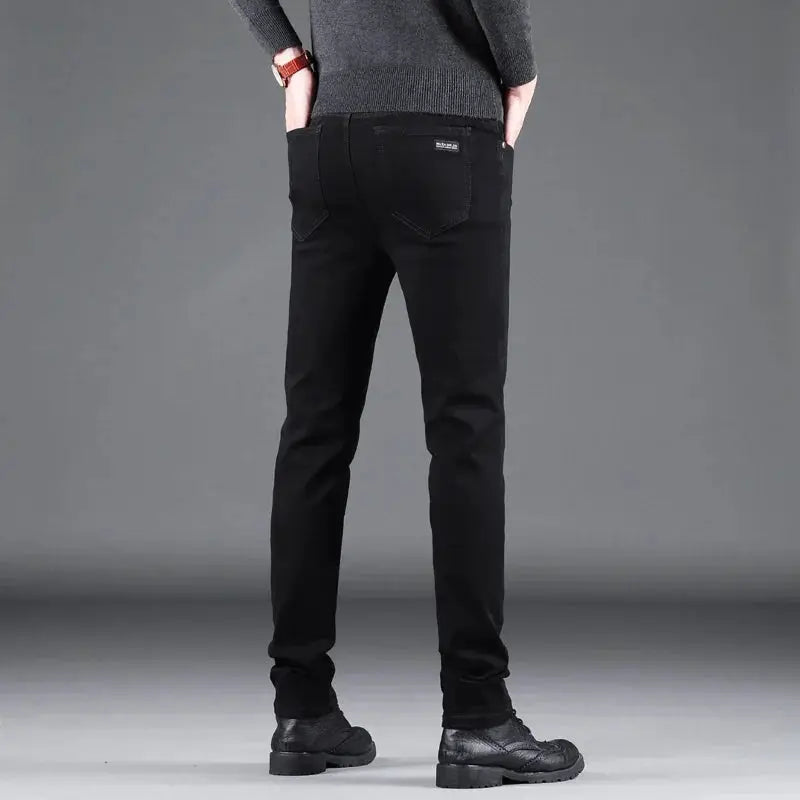 Men's black slim straight denim jeans by Simples Market, back view with pockets and subtle stitching.