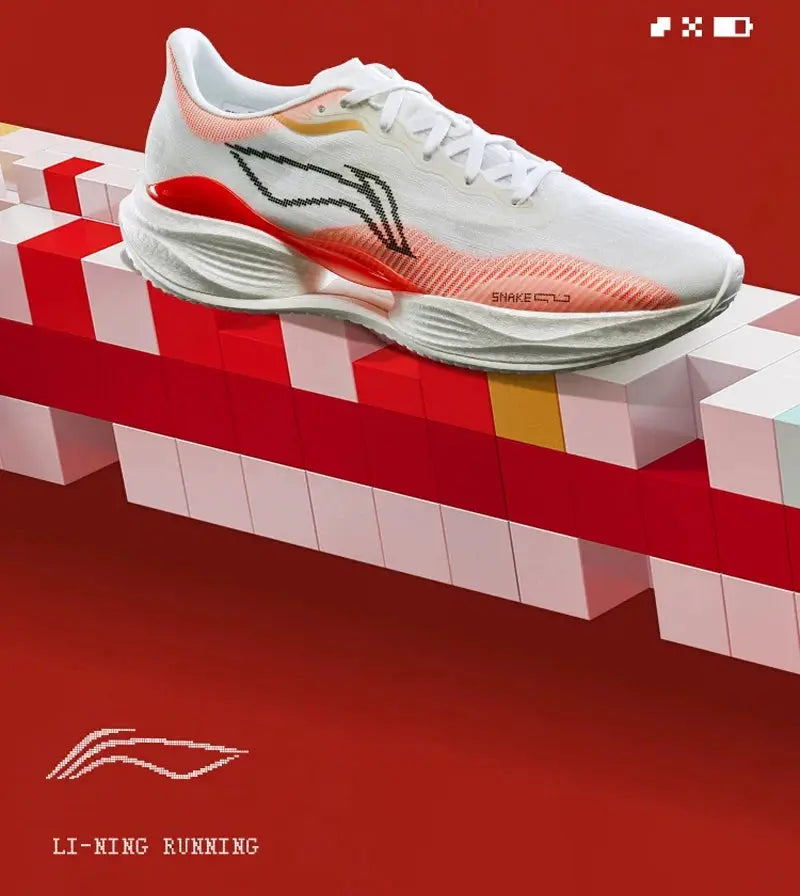 Li-Ning men's white running shoe with pink-orange gradient accents and anti-slip sole, Li-Ning logo visible.