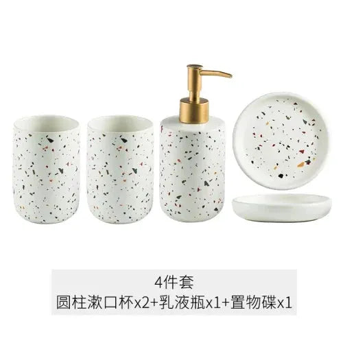 Simples Market terrazzo ceramic 4-piece bathroom set: 2 speckled cups, lotion bottle with gold pump, and soap dish.