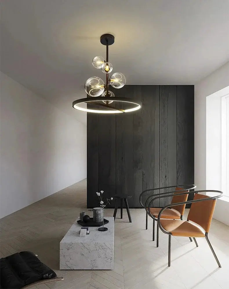 Modern art glass chandelier with circular LED ring and clear glass globe accents, bronze finish.