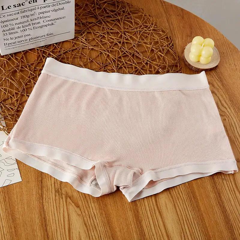 BANNIROU mid-rise seamless women's boyshort panties in pale pink with white waistband.
