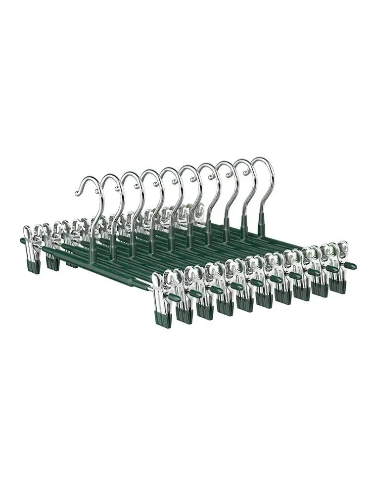 Wardrobe drying rack with skirt clips and stainless steel pants clips on a green plastic frame