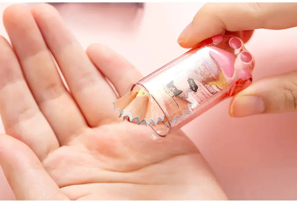 Kawaii cat paw pencil sharpener in pink translucent case by Simples Market stationery gift