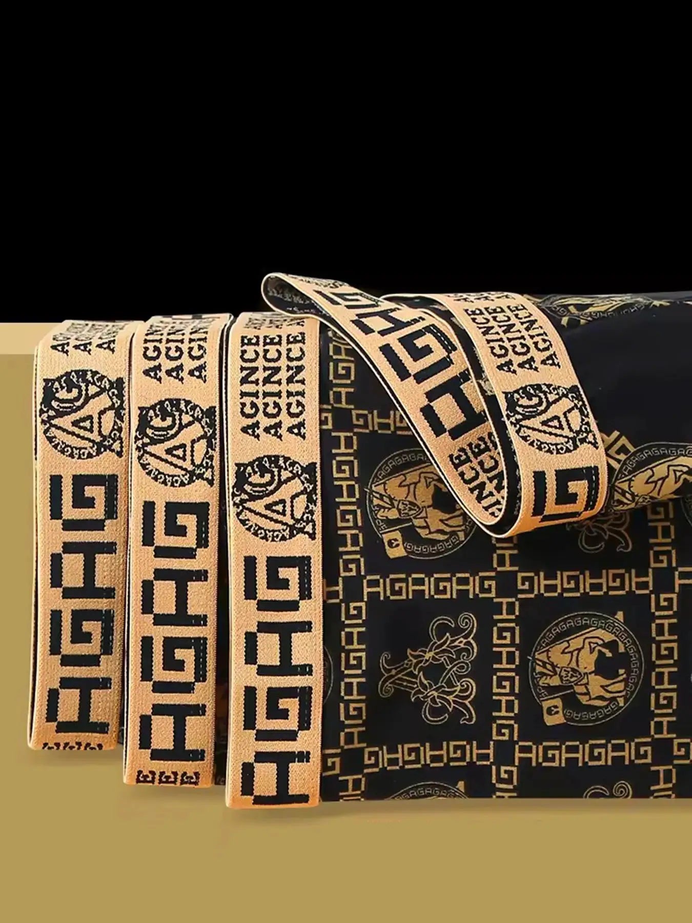 Bedding set with beige decorative ribbons bearing Greek-key patterns and crest motifs on black-gold fabric.