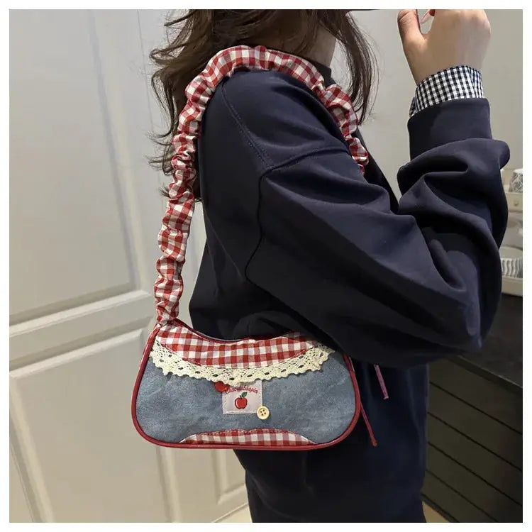Simples Market crossbody tote bag with denim body, red gingham trim and lace, apple patch