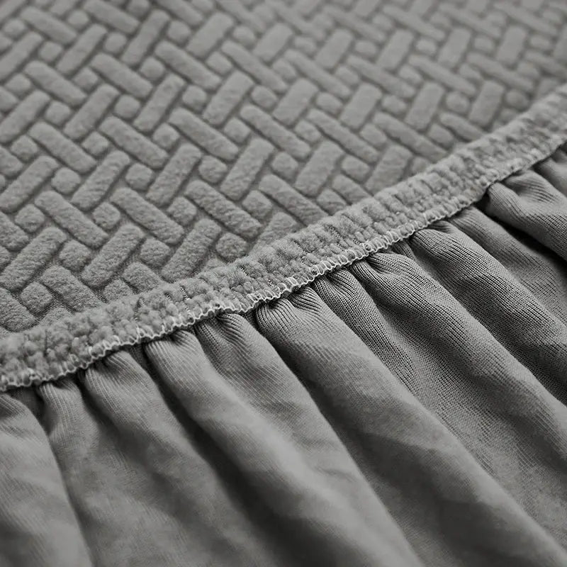 Elastic jacquard sofa cover in gray with gathered edge for L-shape sectional by Simples Market