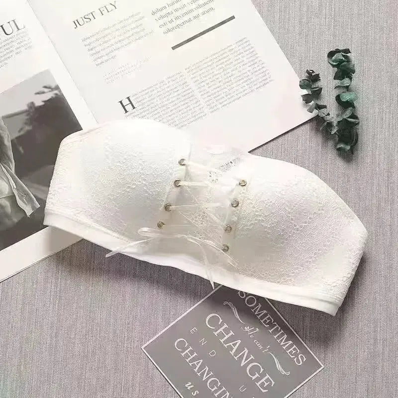 Women's white lace strapless push-up bra by Simples Market with front lace-up corset detail