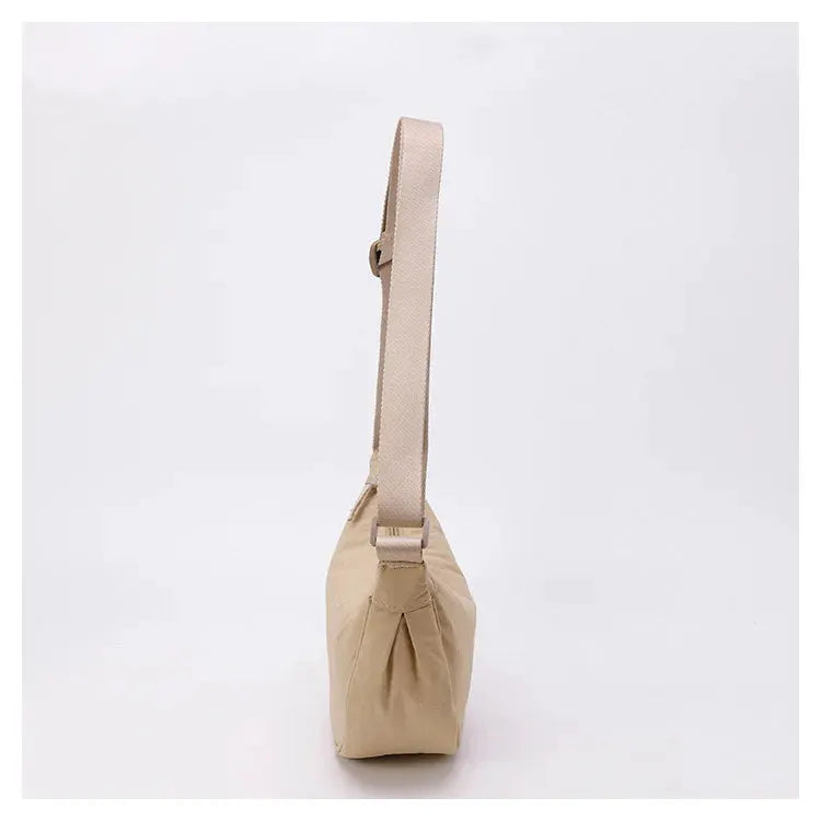 Nylon zipper crossbody bag beige crescent-dumpling shape with adjustable strap, Simples Market.