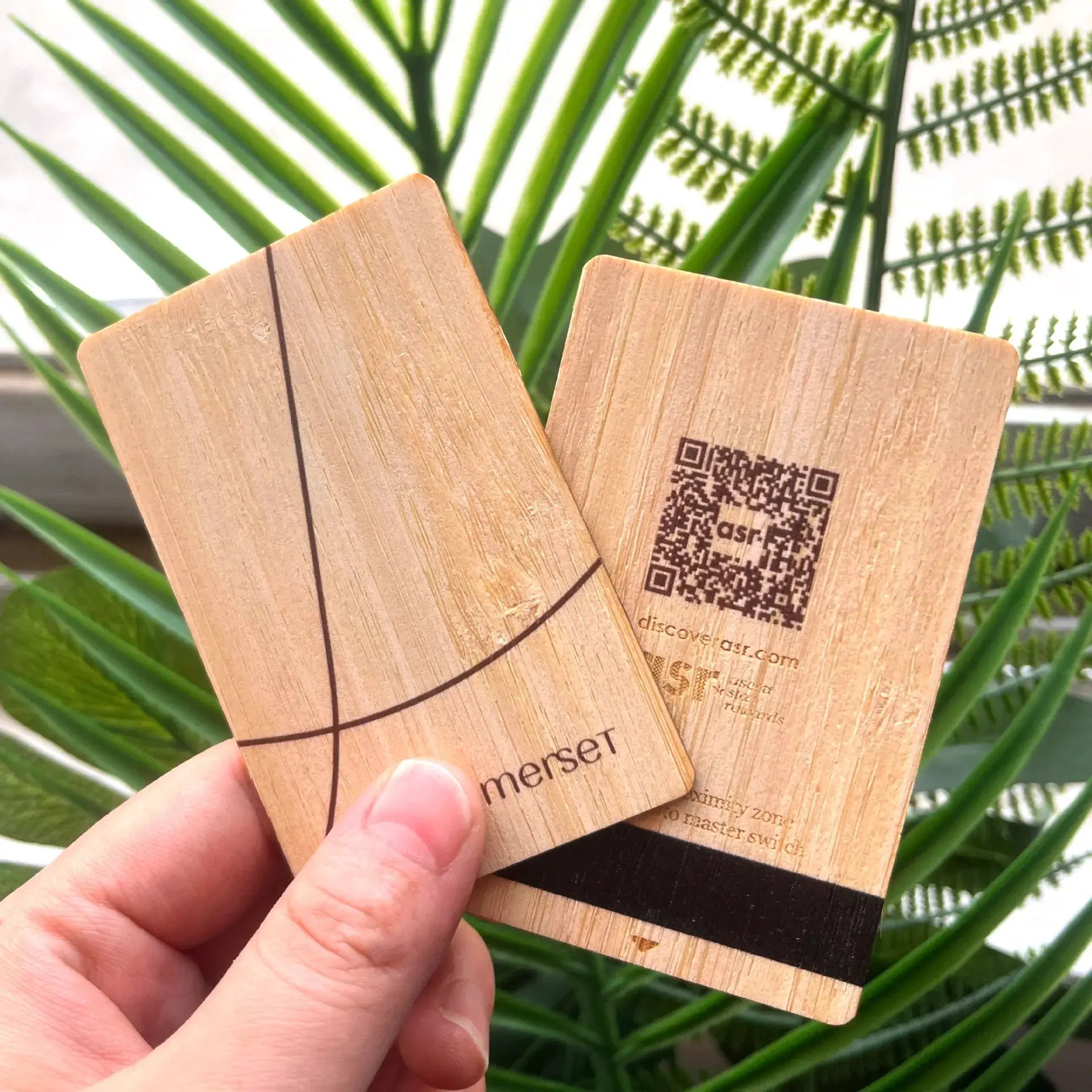 Two wooden NFC lasercards by Simples Market with QR code