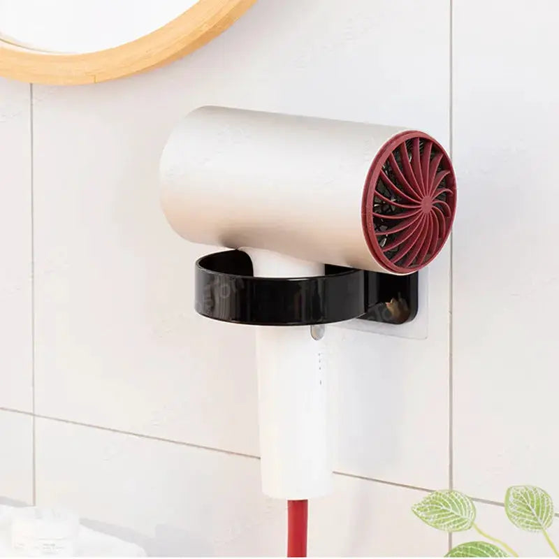 Hair dryer holder rack by Simples Market; beige wall-mounted adhesive unit with red vent and black ring