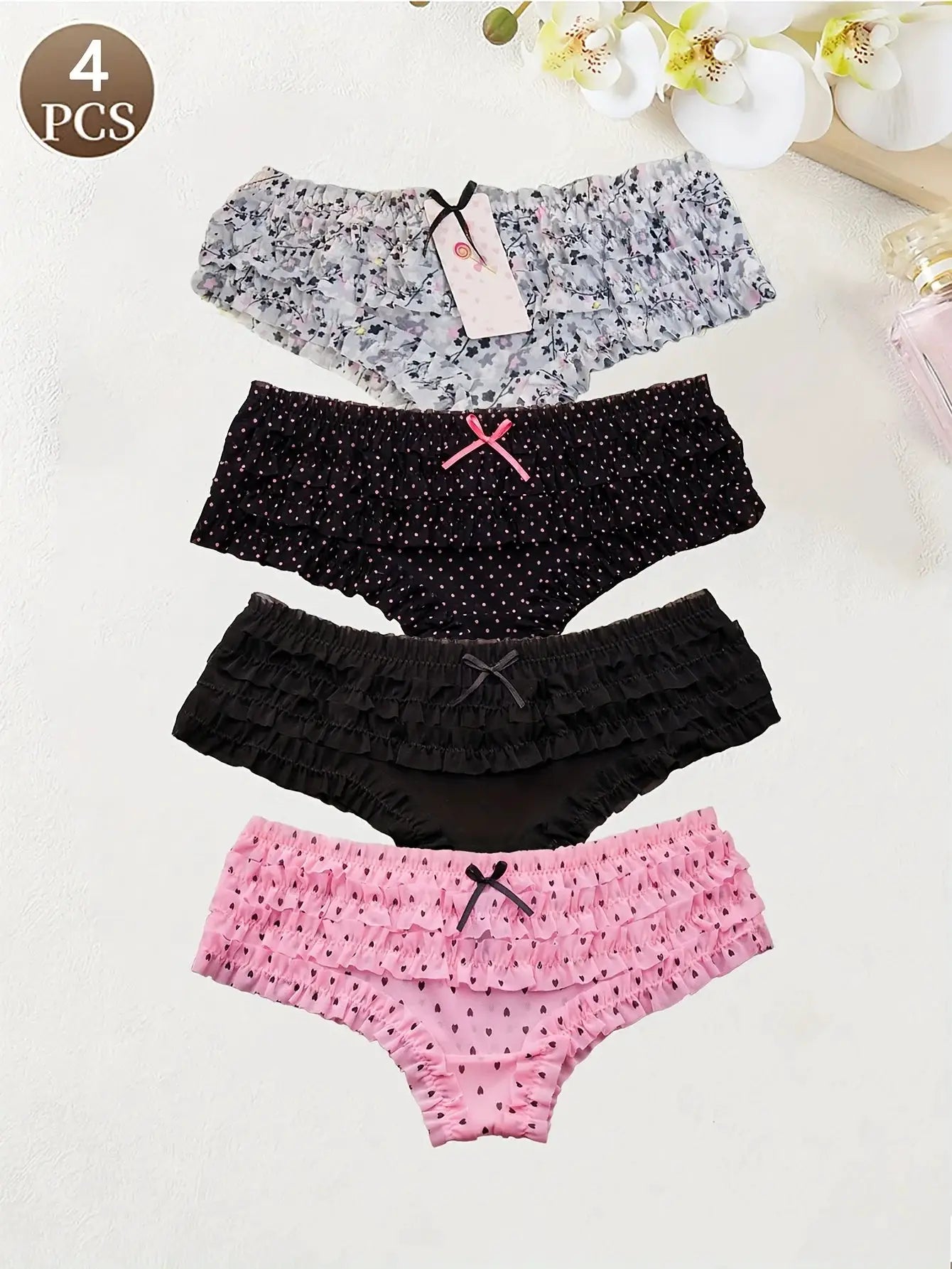 4-pack women's low-waist briefs in floral and dotted patterns with lace-trim knitted fabric, breathable and seamless.
