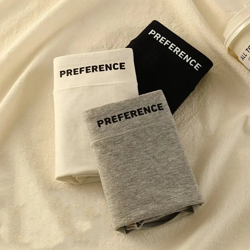 3-pack cotton high-waist panties in white, black and gray with PREFERENCE waistband.