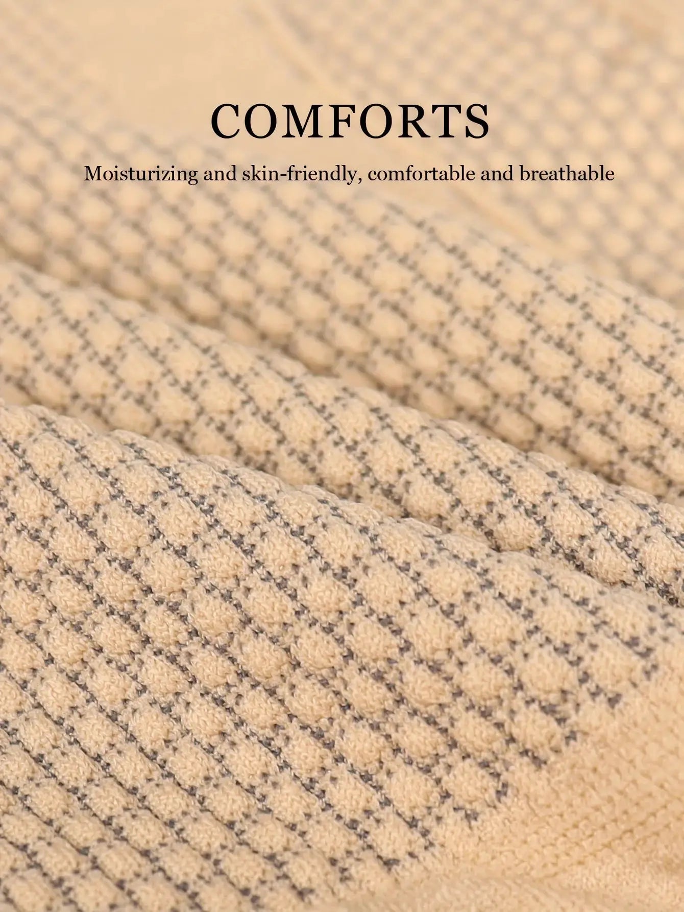 Beige textured knit fabric close-up with a dotted stripe pattern.
