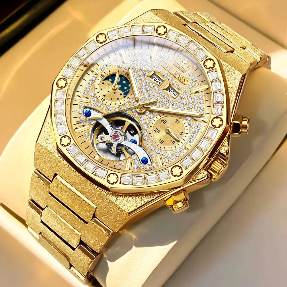OLEVS gold-tone steel men's luxury watch with diamond-studded bezel, exposed tourbillon, and metal bracelet.