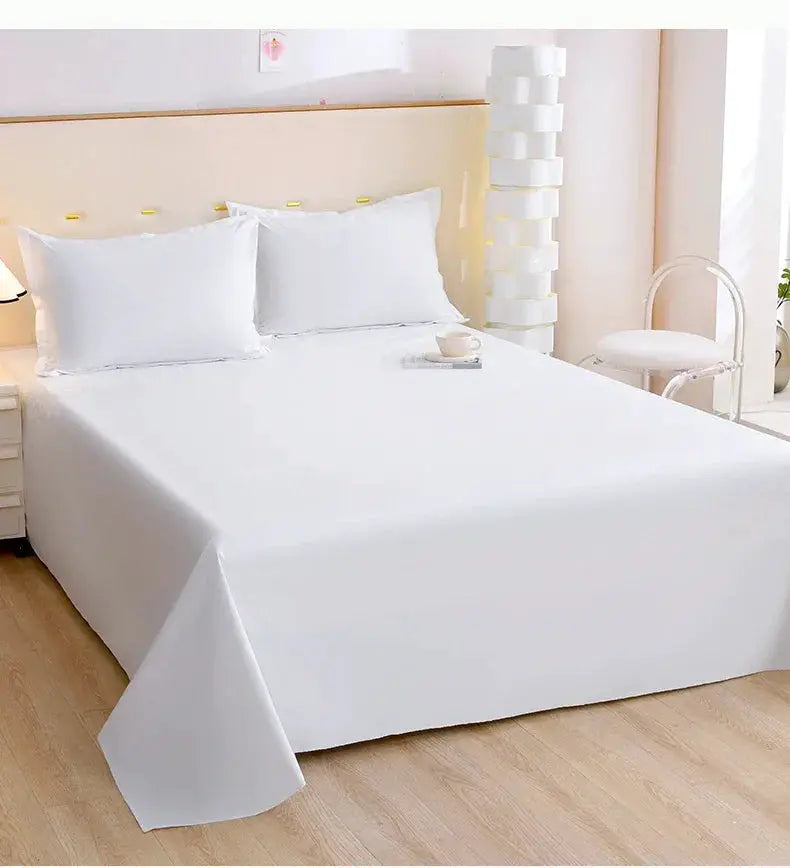 White TPU waterproof bed flat sheet on a neatly made bed