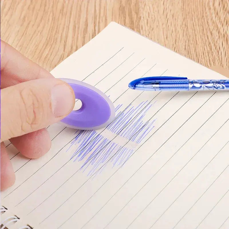 Simples Market erasable gel pen 0.5mm with blue ink and patterned barrel beside a purple circular accessory