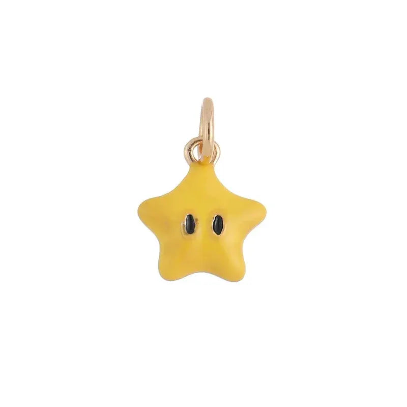 Yellow star pendant earring on a gold-tone hoop, cute cartoon charm style.