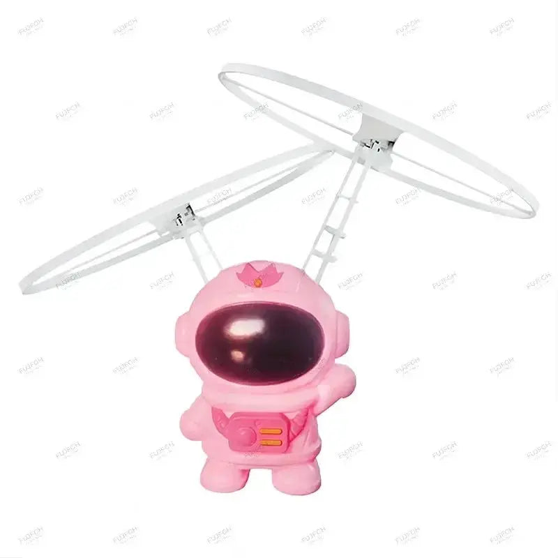 Pink levitating astronaut drone toy with twin-ring rotors and light-up helmet