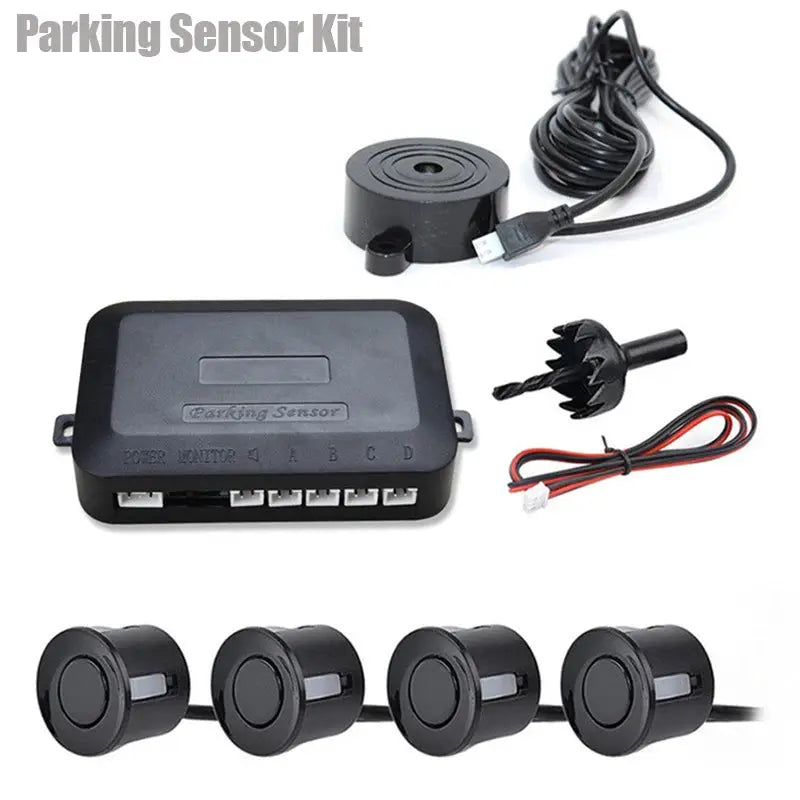 Parking sensor kit with four black 22mm sensors, 12V control box, and wiring harness.