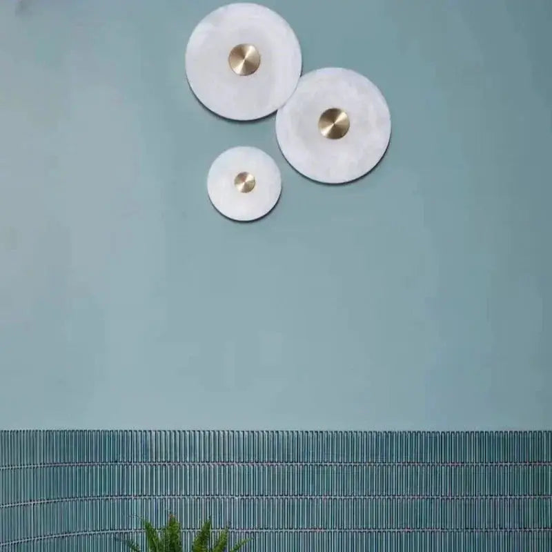 Natural marble wall lamp set with copper centers; three circular LED sconces for living/bedroom decor.