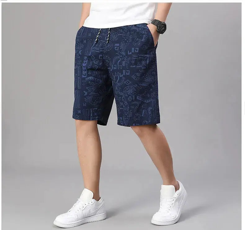 Mens 100% cotton shorts with elastic waist and navy printed design, relaxed fit for beach or casual wear.