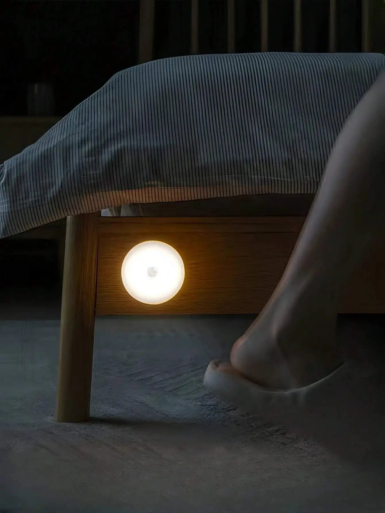 LED Night Light with Motion Sensor by Simples Market, wireless battery-powered, round white globe on bedside table.