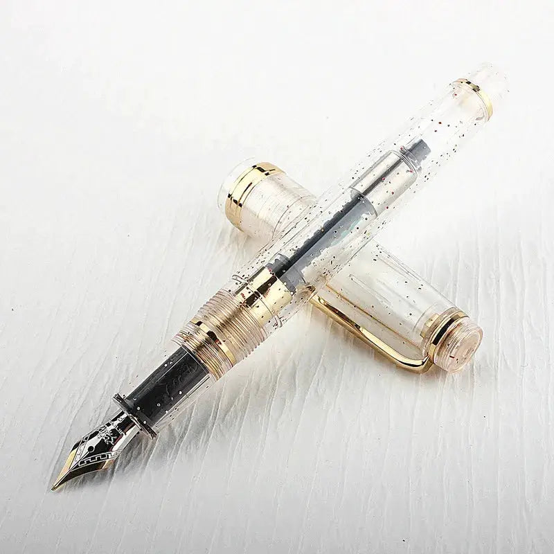 Jinhao 82 fountain pen by Simples Market; clear acrylic body with gold trim, bent nib, converter included