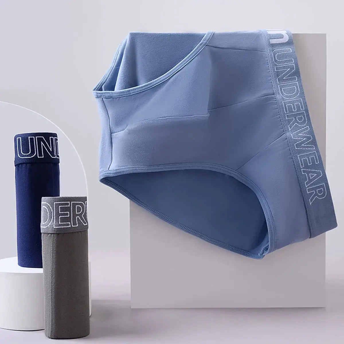 Three-pack men's briefs set in blue, with navy and gray options; elastic waistband with UNDERWEAR lettering
