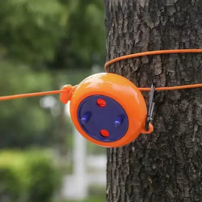 Retractable orange clothesline reel with 10m windproof anti-slip cord for outdoor camping.