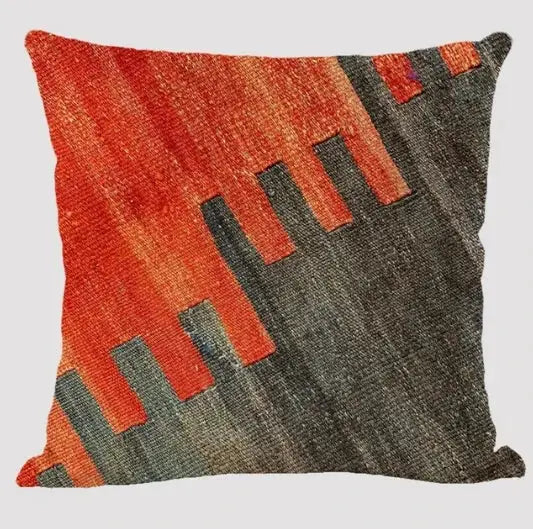 Bohemian linen cushion cover with multicolor abstract geometric pattern in red, orange and gray for living room sofas.
