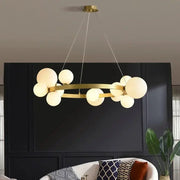 Chandelier with gold finish, curved metal ring and frosted globe bulbs, adjustable cords for living and dining rooms.