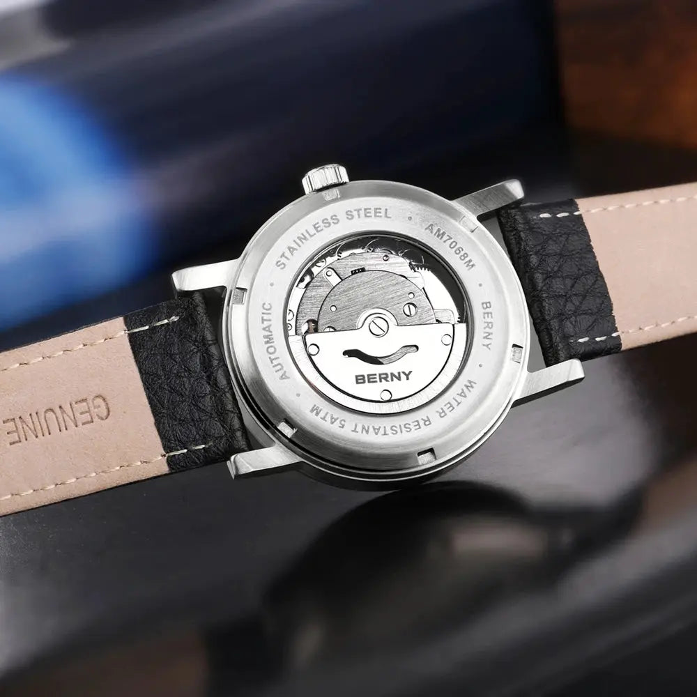 BERNY men's mechanical automatic watch with stainless steel case, visible rotor, and black leather strap.