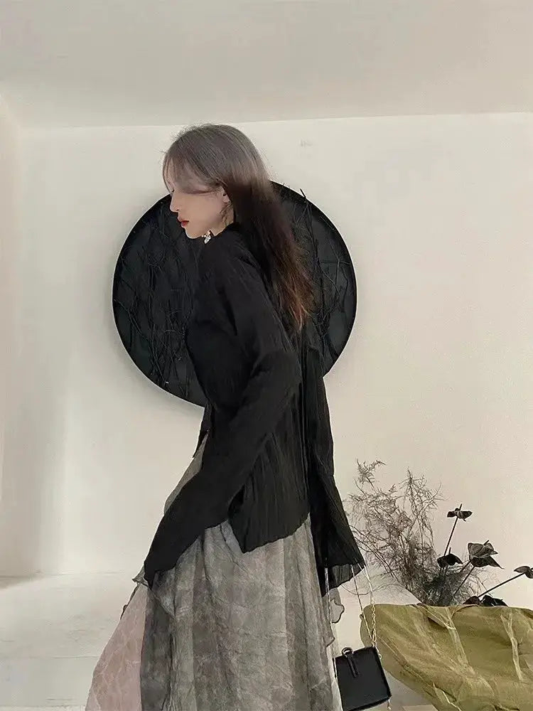 Karrram Gothic black shirt with irregular hem worn by a model