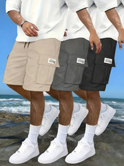 Three pairs of Simples Market men's cargo work shorts in beige, gray, and black with elastic waist and cargo pockets