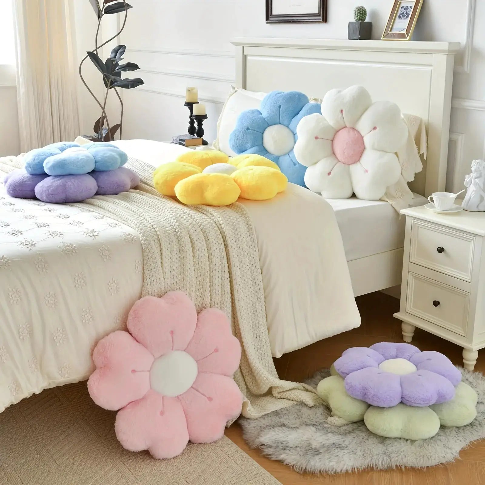 Flower-shaped plush throw pillows set in pastel pink, blue, purple and yellow
