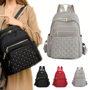 Travel backpack set of 4 by Simples Market; quilted backpacks in black, grey, red, and light-grey with gold zippers.
