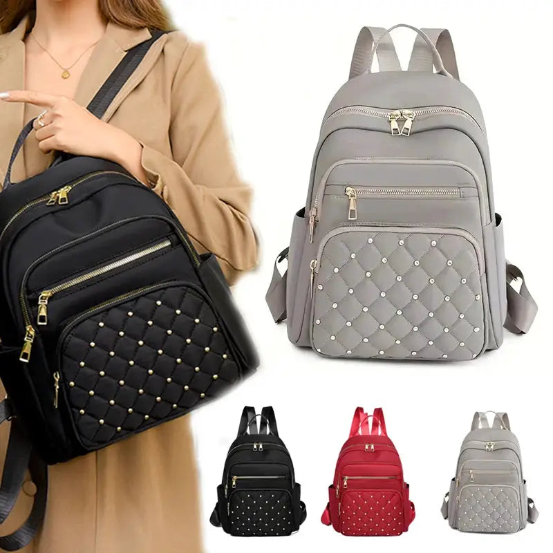 Travel backpack set of 4 by Simples Market; quilted backpacks in black, grey, red, and light-grey with gold zippers.