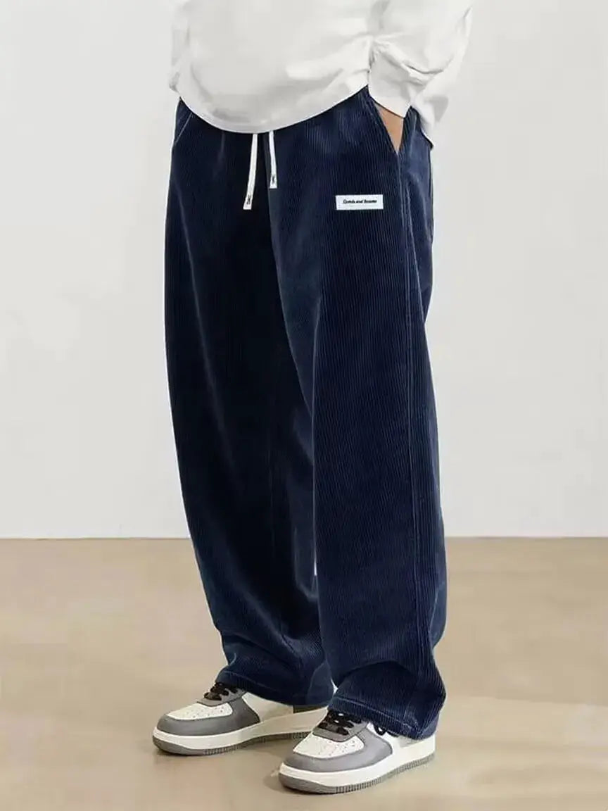 Men's navy corduroy casual pants with elastic drawstring waist and loose straight fit by Simples Market