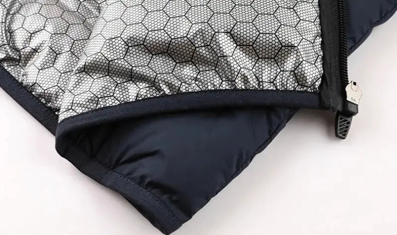 Men's navy down jacket with silver hexagonal quilt lining and visible zipper pull