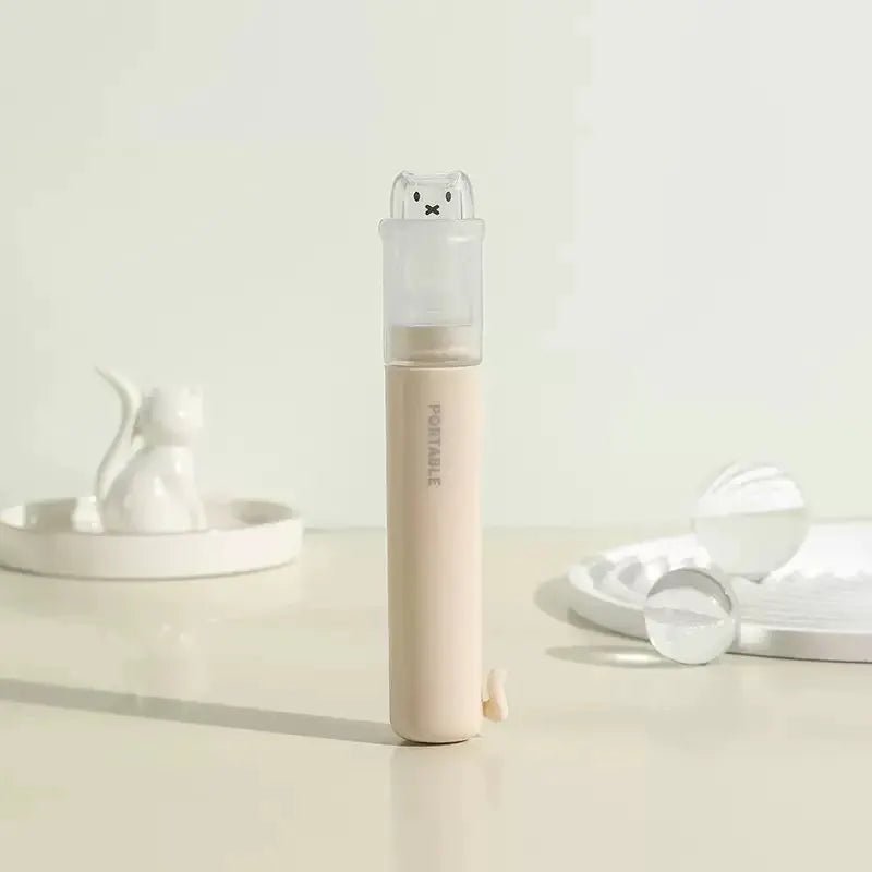 Simples Market 2-in-1 foldable travel toothbrush with bear dust cover in pastel pink macaron color