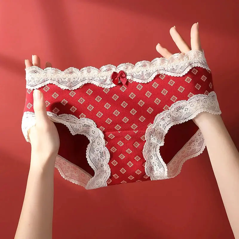 Triangular cotton panties in red with white lace trim and a small bow