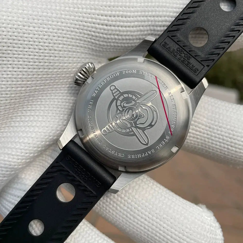 STEELFLIER SF741 wristwatch with stainless steel case and black silicone strap; engraved aviation motif on the back.